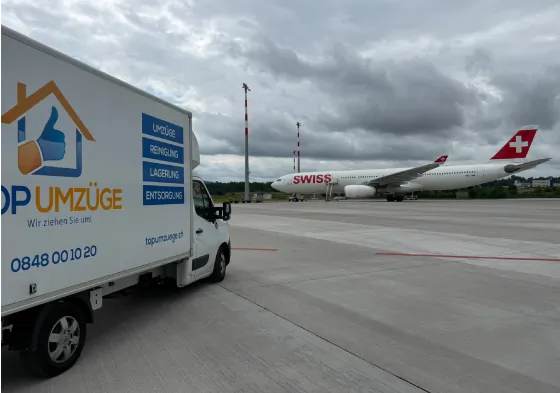 Top-Umzüge-AG-Internationaler-Umzug-Umzugsfirma-Zürich-Umzugswagen-Privatumzug-Firmenumzug-Umzugsreinigung-Lieferwagen-im-Flughafen-Zürich